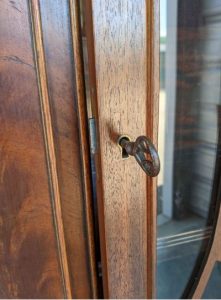 Wood door with dark finish and with key